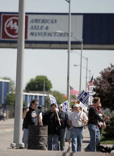 
United Auto Workers Local 235 employees walk the picket line Frioday outside American Axle and Manufacturing in Detroit. Associated Press
 (Associated Press / The Spokesman-Review)