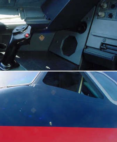 
A gunshot fired from a pistol belonging to the pilot of a US Airways flight Saturday punched a small hole through the plane's cockpit wall, seen at the bottom of this picture. Associated Press
 (Associated Press / The Spokesman-Review)