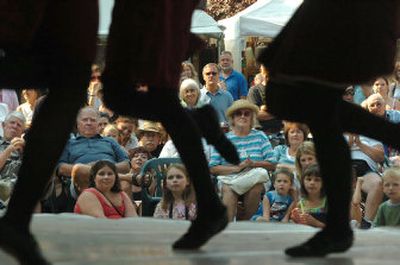 
The crowd at Art on the Green watches Irish dancers Saturday on the main stage at North Idaho College. The annual arts festival – now celebrating its 38th year – is expected to attract more than 50,000 people over its two-and-a-half-day run, which concludes today. 
 (Photos by JESSE TINSLEY / The Spokesman-Review)
