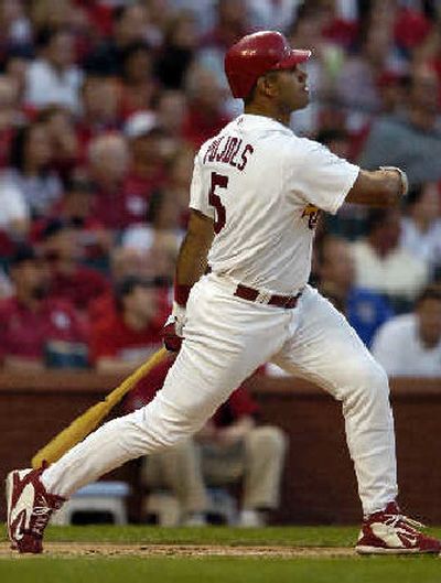 
St. Louis' Albert Pujols watches his first-inning, two-run home run fly away.
 (Associated Press / The Spokesman-Review)