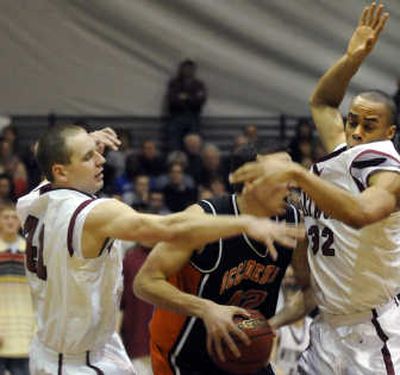 
Whitworth's Tim Sellereit, left, and Ryan Symes defend Occidental's Chris Pitcher. 
 (Dan Pelle / The Spokesman-Review)