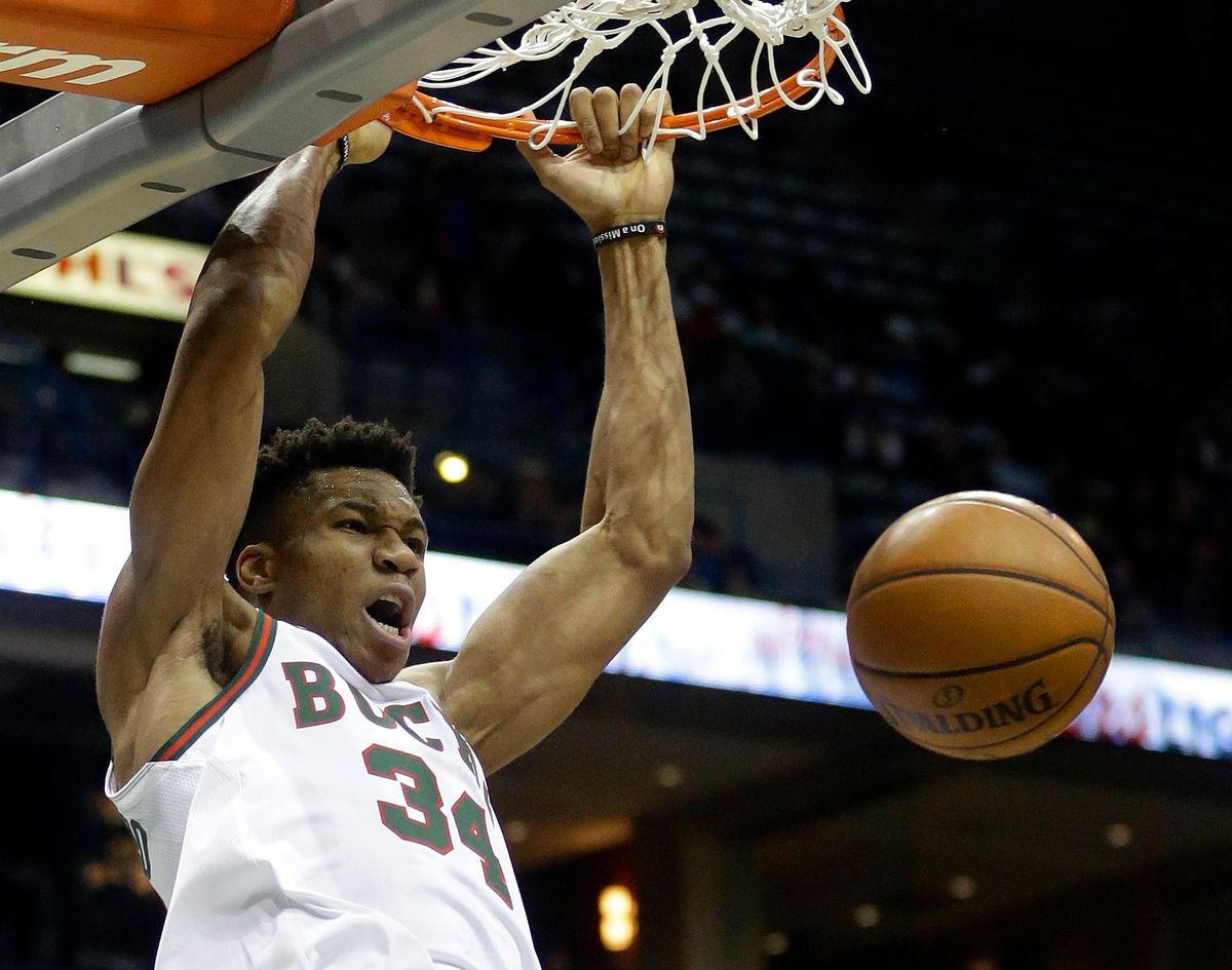 In this Dec. 8, 2017, file photo, Milwaukee Bucks’ Giannis Antetokounmpo dunks during an NBA basketball game against the Dallas Mavericks, in Milwaukee. A billboard down the street from the Bucks nearly completed new arena makes a bold proclamation in big, bold letters: The Future is Here. The rebuilding process is over. Winning a playoff series could make that message resonate as loudly as an Antetokounmpo rim-rattling dunk. (Aaron Gash / Associated Press)
