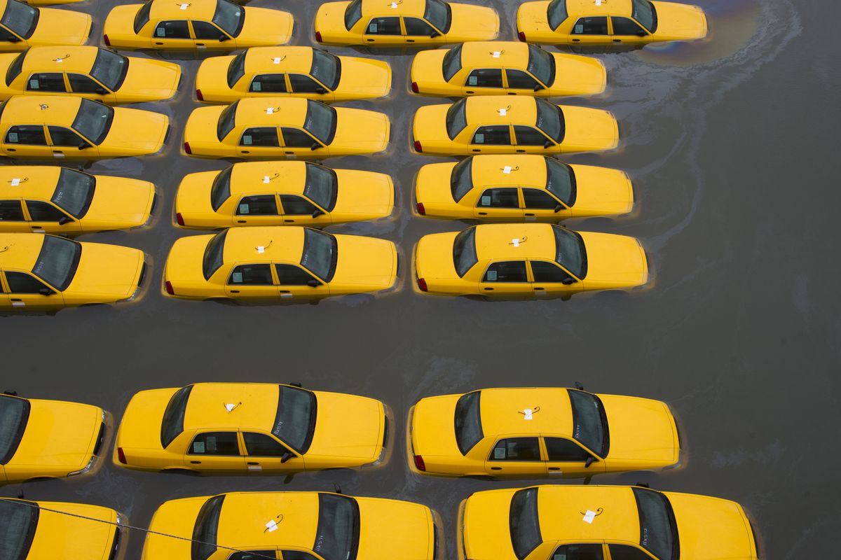 A parking lot full of yellow cabs is flooded as a result of superstorm Sandy on Tuesday, Oct. 30, 2012 in Hoboken, NJ. (Charles Sykes / Fr170266 Ap)