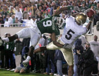
Notre Dame receiver Rhema McKnight hauls in a second-quarter TD pass over MSU's Demond Williams.
 (Associated Press / The Spokesman-Review)