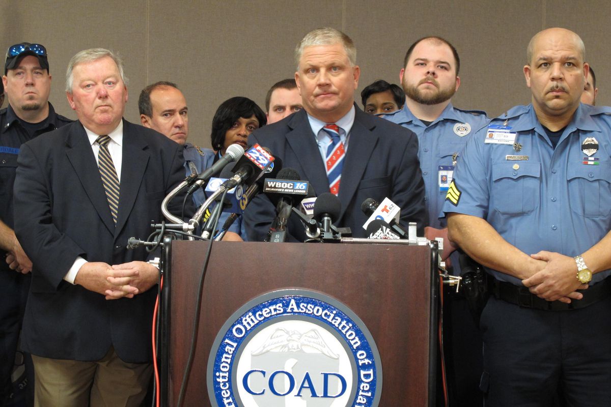 Geoffrey Klopp, center, president of the Correctional Officers Association of Delaware, speaks about a prison uprising Thursday, Feb. 2, 2017, in Dover, Del. Klopp said that he believes the uprising was due to low staffing issues at the 2,500-prisoner James T. Vaughn Correctional Center that have existed for years. (Brian Witte / Associated Press)