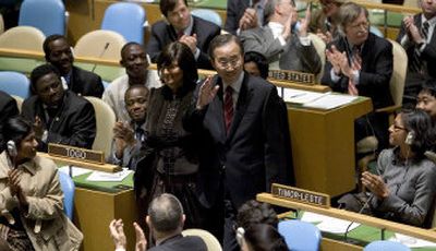 
South Korean Foreign Minister Ban Ki-moon waves as he is escorted into the General Assembly, after a resolution was adopted Friday to appoint him the next United Nations secretary-general . 
 (Associated Press / The Spokesman-Review)