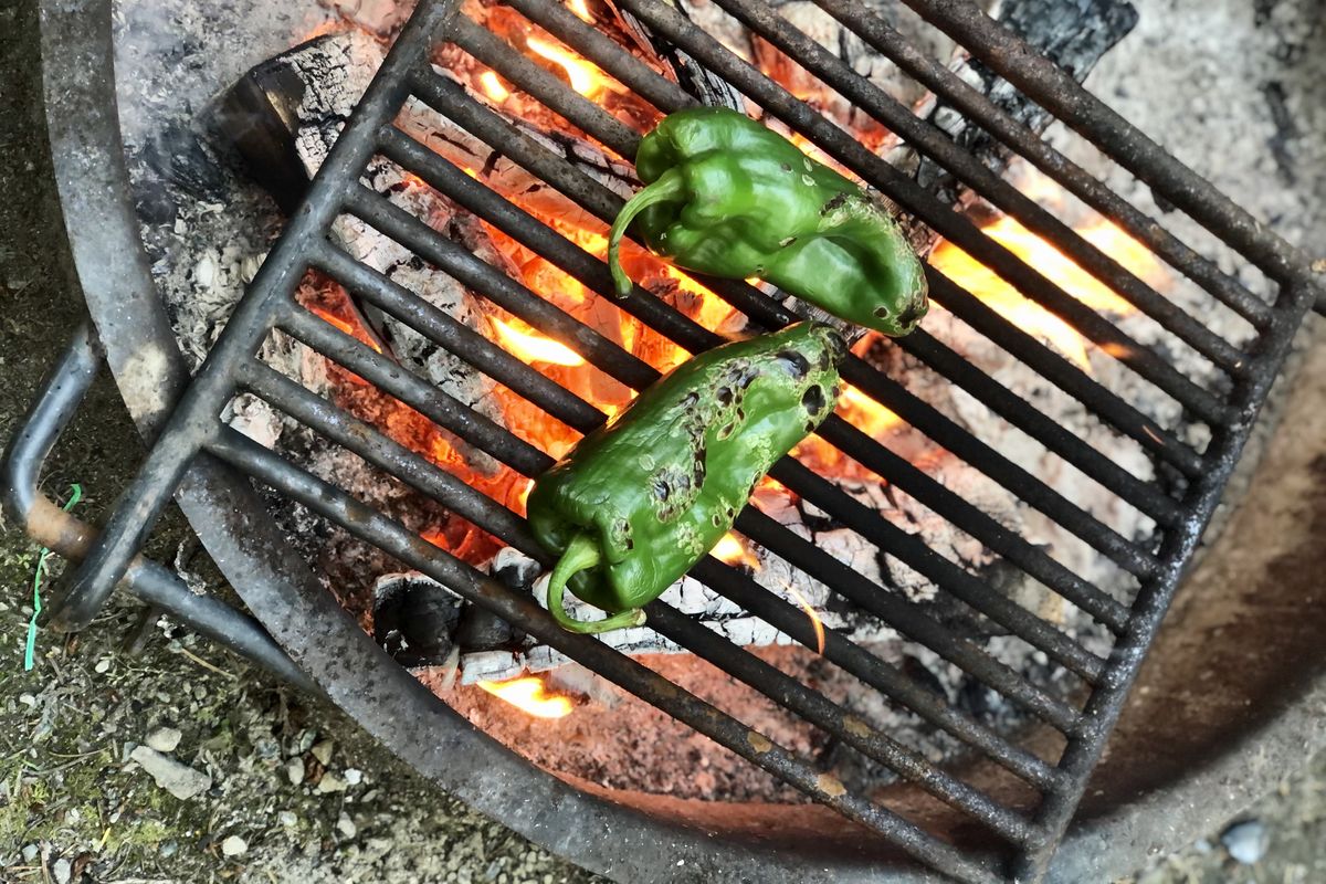 Peppers roasted over the campfire were the key ingredient in a warming meal on a cool evening during a recent trip to Camano Island. (Leslie Kelly)