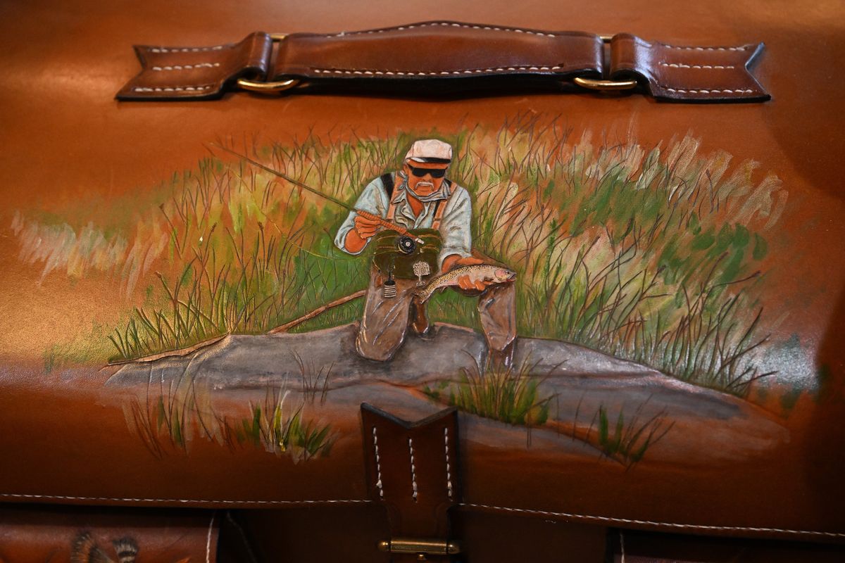 Angler Dave Gunderson is portrayed on this leather equipment case made by James Acord’s Leather in Ohio.  (Tyler Tjomsland/The Spokesman-Review)