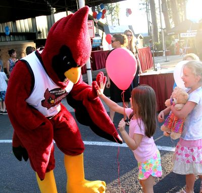 Cecil the Cardinal high-fives kids after the winners were announced at the NIC Foundation’s Really BIG Raffle Wednesday. (Tom Greene/North Idaho College Press Room photo)