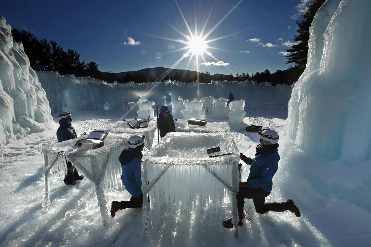 In this Monday, Jan. 28, 2019 photo, icicles are harvested for use in growing the walls at Ice Castles in North Woodstock, N.H. The winter wonderland is one of six in North America. (Robert F. Bukaty / Associated Press)