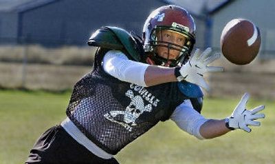 
Colville two-way standout John Roberts, whose future may be on defense, concentrates on a pass during practice last week. 
 (Christopher Anderson / The Spokesman-Review)