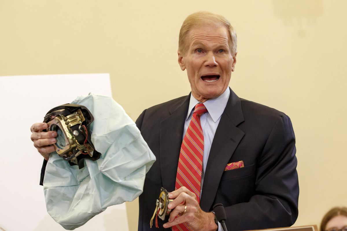 Senate Commerce Committee member Sen. Bill Nelson, D-Fla., displays the parts of a defective air bag made by Takata of Japan, during the committee’s hearing on Capitol Hill. The air bags have been linked to multiple deaths and injuries in cars in the U.S. (Associated Press)