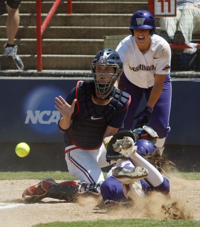 Amanda Fleischman, right, is thrown out in the Huskies’ 4-3 loss, eliminating UW from a chance to repeat as NCAA champions.  (Associated Press)