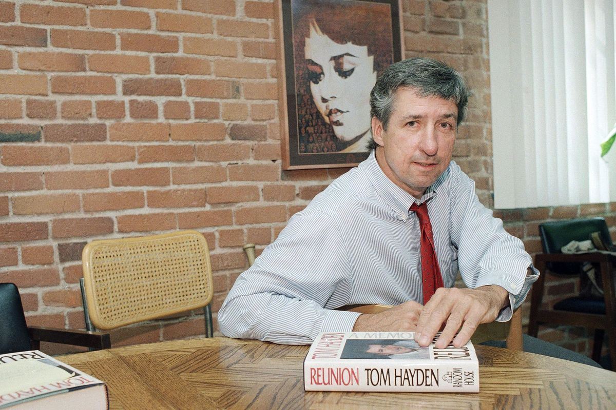 FILE - In this June 6, 1988 file photo, Tom Hayden talks about his new book, "Reunion," during a interview at his office in Santa Monica, Calif. Hayden, the famed 1960s anti-war activist who moved beyond his notoriety as a Chicago 8 defendant to become a California legislator, author and lecturer, has died. (Lennox McLendon / AP)