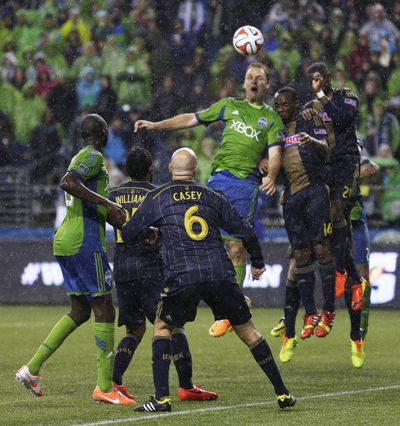Sounders FC defender Chad Marshall, center, scores his first goal of season in the 84th minute. (Associated Press)
