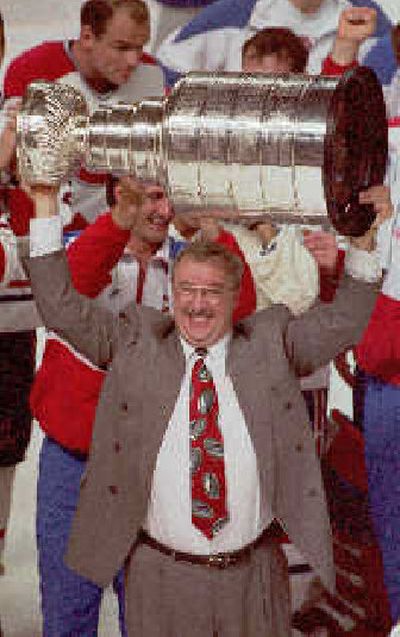 
 Jacques Demers lifts the Stanley Cup during his coaching days with the Montreal Canadiens in 1993. 
 (Associated Press / The Spokesman-Review)