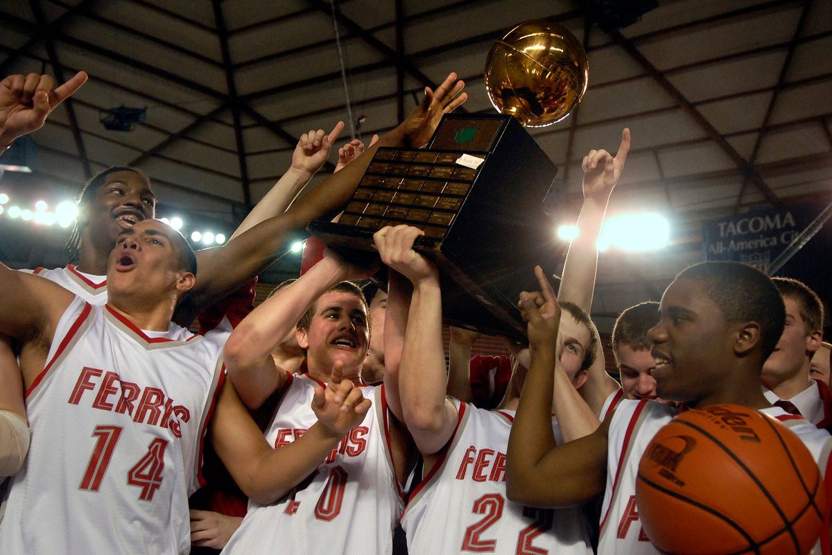 The Ferris Saxons celebrate their State 4A Basketball Championship double-overtime victory over Kentridge at the Tacoma Dome on March 3, 2007.  (Holly Pickett/The Spokesman-Review)