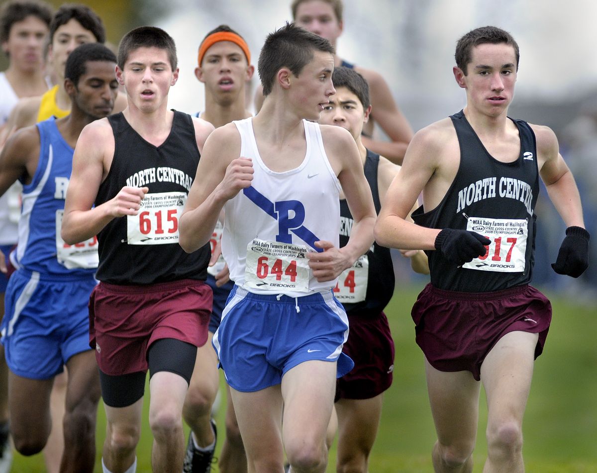 North Central runners, including Andrew Kimpel, right, keep up with the pack early in the 3A State Championship cross country race.   (Christopher Anderson / The Spokesman-Review)
