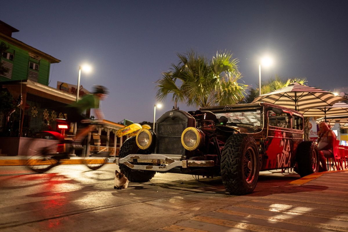A rat rod is parked in front of a beach bar in the Boquerón village in Cabo Rojo. MUST CREDIT: Ricardo Arduengo for The Washington Post  (Ricardo Arduengo/For The Washington Post)
