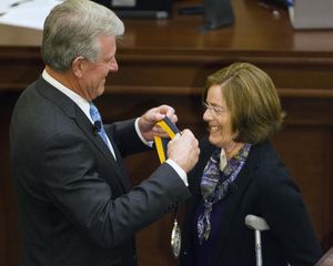 Idaho Gov. Butch Otter bestows the first Idaho Medal of Achievement on teacher-astronaut Barbara Morgan (AP / Otto Kitsinger)