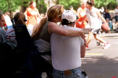 
Two rules for Hoopfest spectators – 1, Love the one you're with, and 2, bring sunglasses. 
 (The Spokesman-Review)