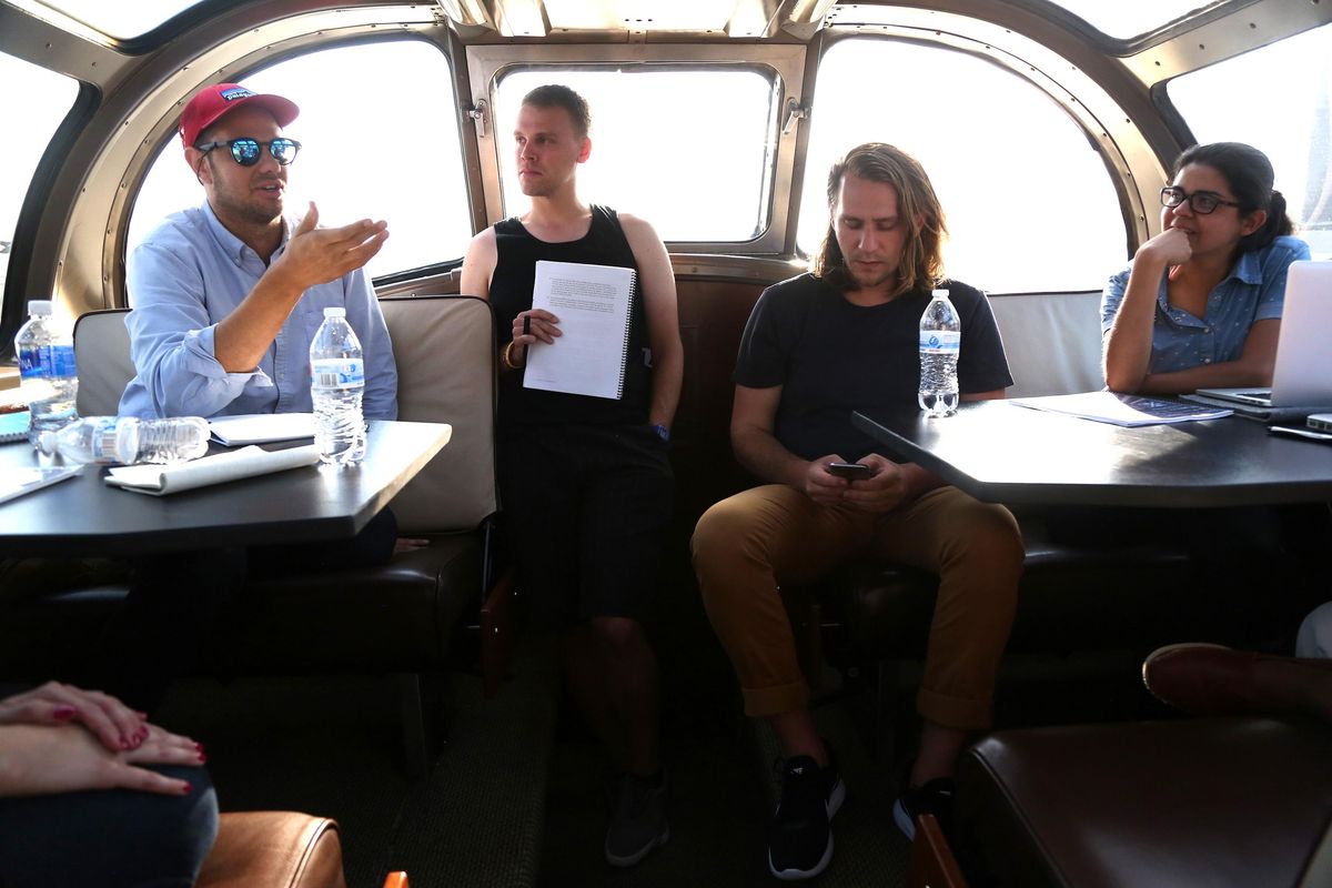 Below: Richard Portwood of Washington D.C., Tom Krueger of Minneapolis, Greg Burkett of San Francisco and Yano Pomalama of Peru talk after spending the day in Kansas City. (Tribune News Service photos)