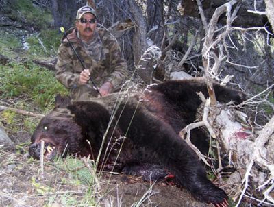 Ron G. Leming poses with the 500-pound grizzly bear he shot after the bear attacked his son, Ron J. Leming, in Wyoming’s Washakie Wilderness on Sept. 12.  (Associated Press / The Spokesman-Review)