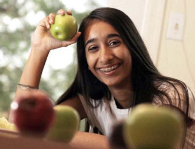 
Young people know how to eat wisely, and many do, though it's hard to resist temptations. Sajni Patel says, though it's not a common snack for a 15-year-old, she loves fresh fruit. 
 (Washington Post / The Spokesman-Review)