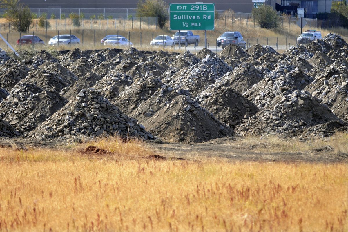 Mounds of rocks sit  on the Hanson Industries’ project site  north of Interstate 90, near  Sullivan Road. (J. BART RAYNIAK / The Spokesman-Review)