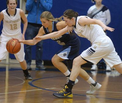 Gonzaga Prep's Laura Stockton, center, and Mead's Coreen Labish, right, chase a rebound across the floor Tuesday, Dec. 17, 2013 at Mead High School.  Delany Junkermier looks on at left. (Jesse Tinsley / The Spokesman-Review)