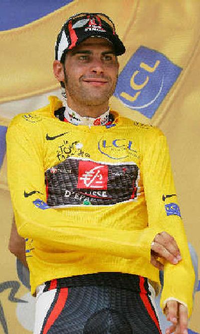 
Overall leader Oscar Pereiro of Spain puts on the yellow jersey after retaining it on Thursday. 
 (Associated Press / The Spokesman-Review)