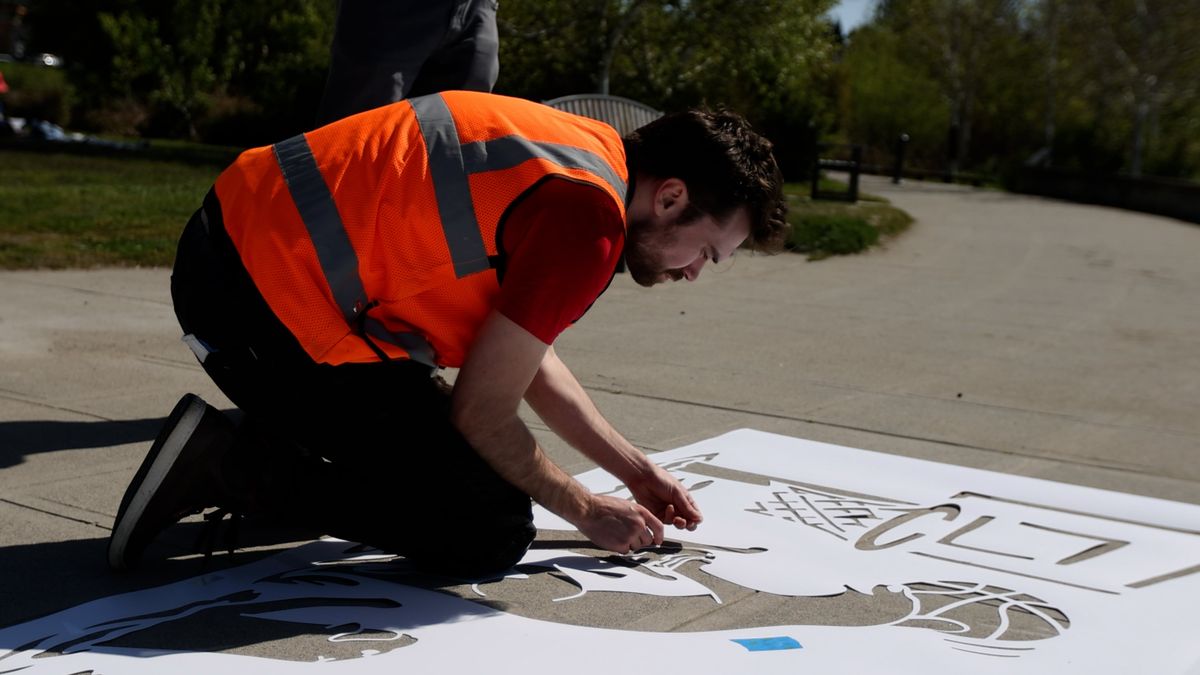 Peregrine Church works with a stencil in 2024.  (Washington Post )