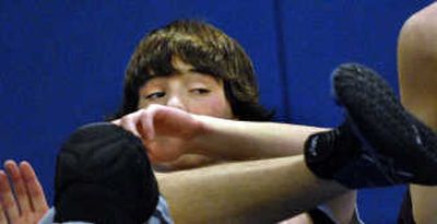 
Coeur d'Alene High School wrestler Braden Mowry practices at the school. Mowry has worked his way back from a neck and knee injury, and has a 20-6 record.
 (Kathy Plonka / The Spokesman-Review)