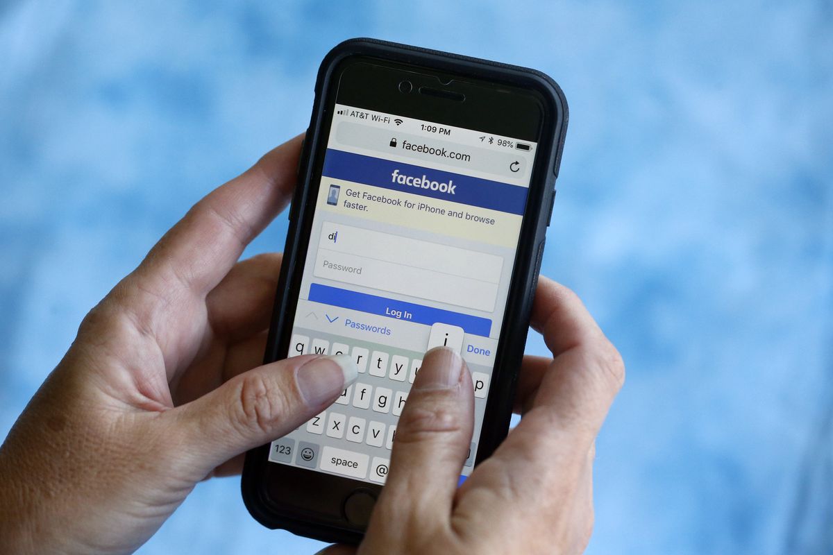FILE – In this Aug. 21, 2018, file photo, a Facebook start page is shown on a smartphone in Surfside, Fla. Security researchers have uncovered more instances of Facebook user data being publicly exposed on the internet, further underscoring its struggles as it deals with a slew of privacy and other problems. (AP Photo/Wilfredo Lee, File)  (Wilfredo Lee / Associated Press)