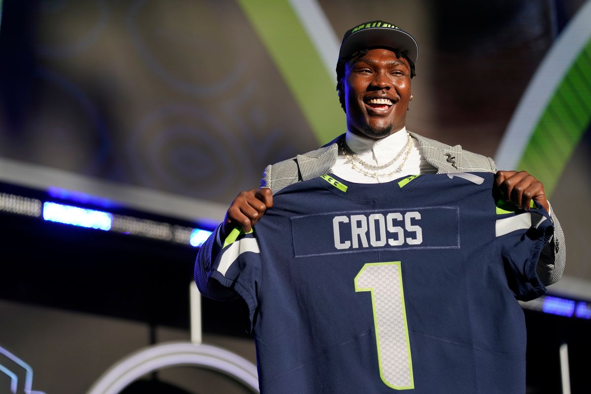 Mississippi State’s Charles Cross holds a Seahawks jersey after being chosen with the ninth pick of the NFL draft Thursday. (Associated Press)