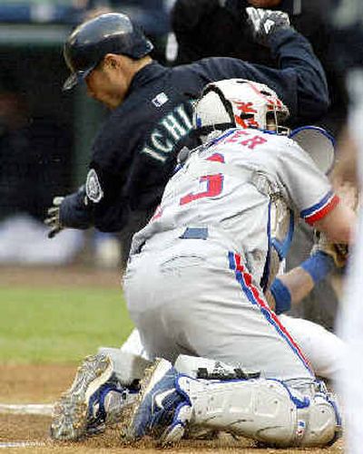 Ichiro Suzuki is tagged out at home.
(Associated Press / The Spokesman-Review)