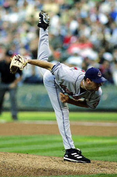 
Cleveland's Cliff Lee held Seattle in check before giving up 3 runs in the 7th. 
 (Associated Press / The Spokesman-Review)
