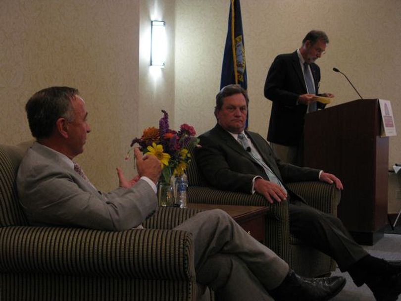 Democratic Congressman Walt Minnick, left, and Republican Congressman Mike Simpson appear together at a City Club of Boise forum attended by more than 400 people. At right is moderator Marty Peterson. (Betsy Russell / The Spokesman-Review)