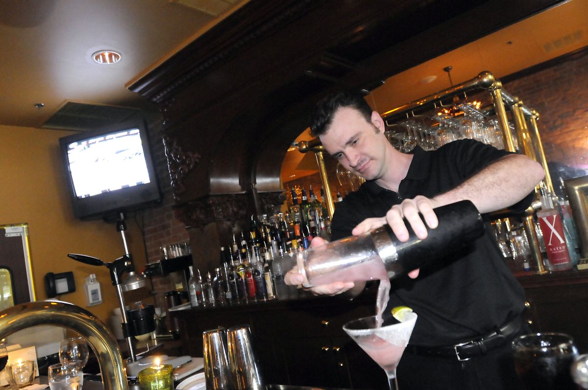 At Cavallino Lounge, Andrew Gumprecht mixes an Infrared martini.  (Jesse Tinsley / The Spokesman-Review)