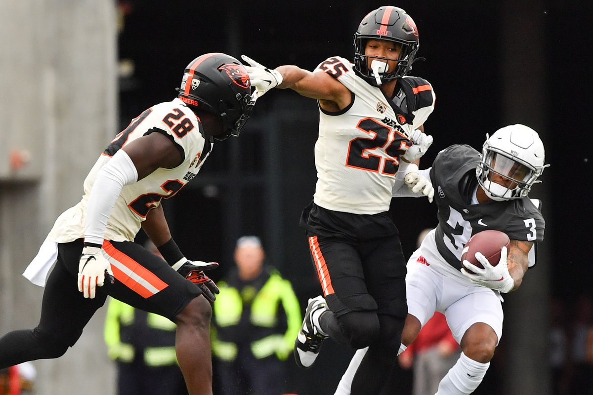 Washington State Cougars wide receiver Josh Kelly (3) hauls in a pass against Oregon State Beavers defensive back Tyrice Ivy Jr. (25) during the first half of a college football game on Saturday, Sept. 23, 2023, at Martin Stadium in Pullman, Wash.  (Tyler Tjomsland/The Spokesman-Review)