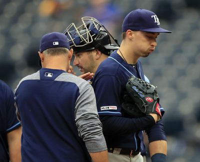 Tampa Bay Rays starting pitcher Blake Snell, right, is taken out by manager Kevin Cash, left, during the fourth inning of a May 1, 2019 game against the Kansas City Royals at Kauffman Stadium in Kansas City, Mo. Rays All-Star pitcher Blake Snell says he will not take the mound this year if his pay is cut further, proclaiming: “I’m not playing unless I get mine.” the 2018 AL Cy Young Award winner said on a Twitch stream Wednesday, May 14 2020. (Orlin Wagner / AP)