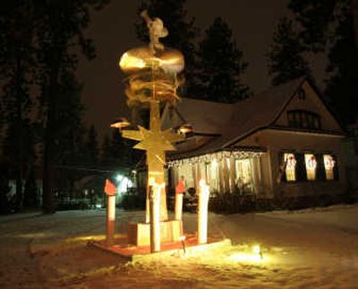 
This handmade replica of a traditional Swedish candle ornament spins each night outside a house on Spokane's Manito Boulevard.
 (Photo COURTESY OF COLLIN KLAMPER / The Spokesman-Review)