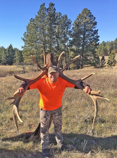 Garth Sessions was all smiles as he carried out what would become the largest nontypical bull elk recorded in Montana. He shot the elk while hunting on public land in southeastern Montana, and while wearing his lucky hat. (Scott Sessions / Courtesy photo)