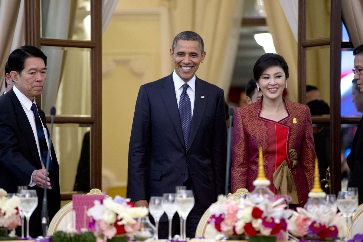 U.S. President Barack Obama, second left, and Thai Prime Minister Yingluck Shinawatra, second right, arrive for an official dinner at Government House in Bangkok, Thailand, Sunday, Nov. 18, 2012. (Carolyn Kaster / Associated Press)