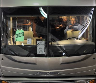 RV shoppers take a close look at a 36-foot Pace Arrow motor home on clearance at the RV Show at the Spokane County Fair & Expo Center in Spokane last January. This year’s show starts Thursday.  (File)