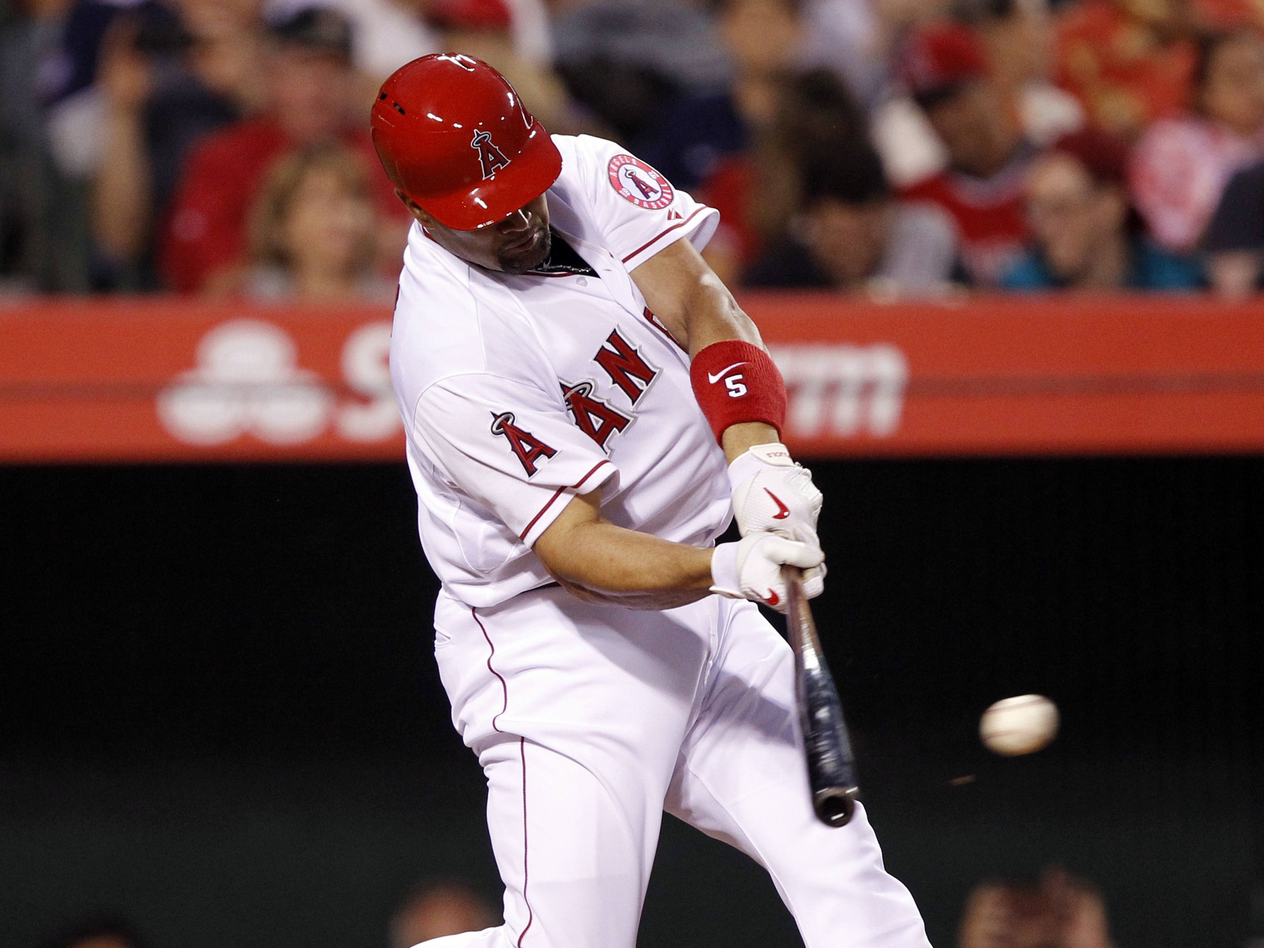 St. Louis Cardinals Albert Pujols gives his son Ezra (19 months) a