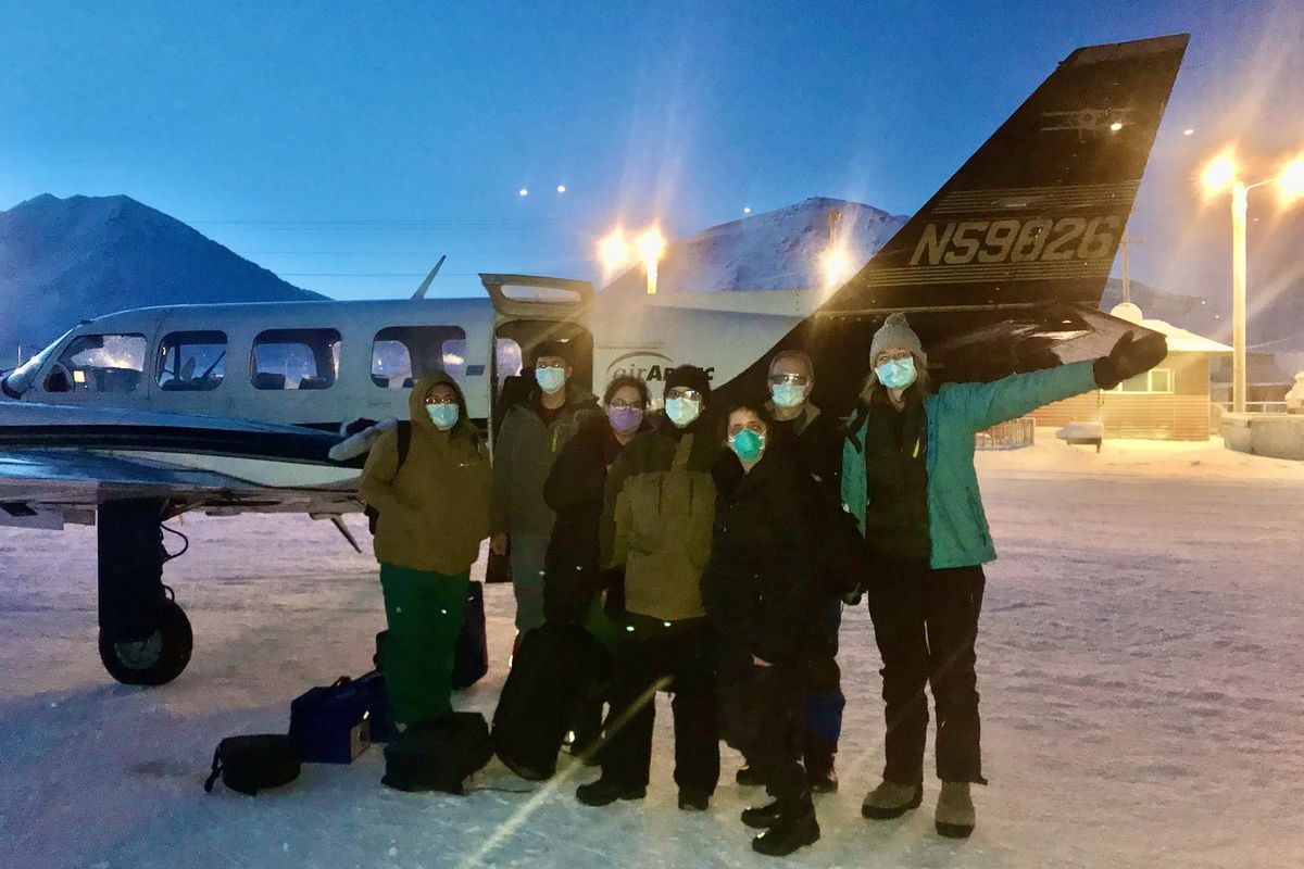 In this undated photo, provided by the Tanana Chiefs Conference, shows a team from the tribal health organization posing outside a plane before leaving for a rural vaccination clinic in Anaktuvuk Pass, Alaska. Some of Alaska