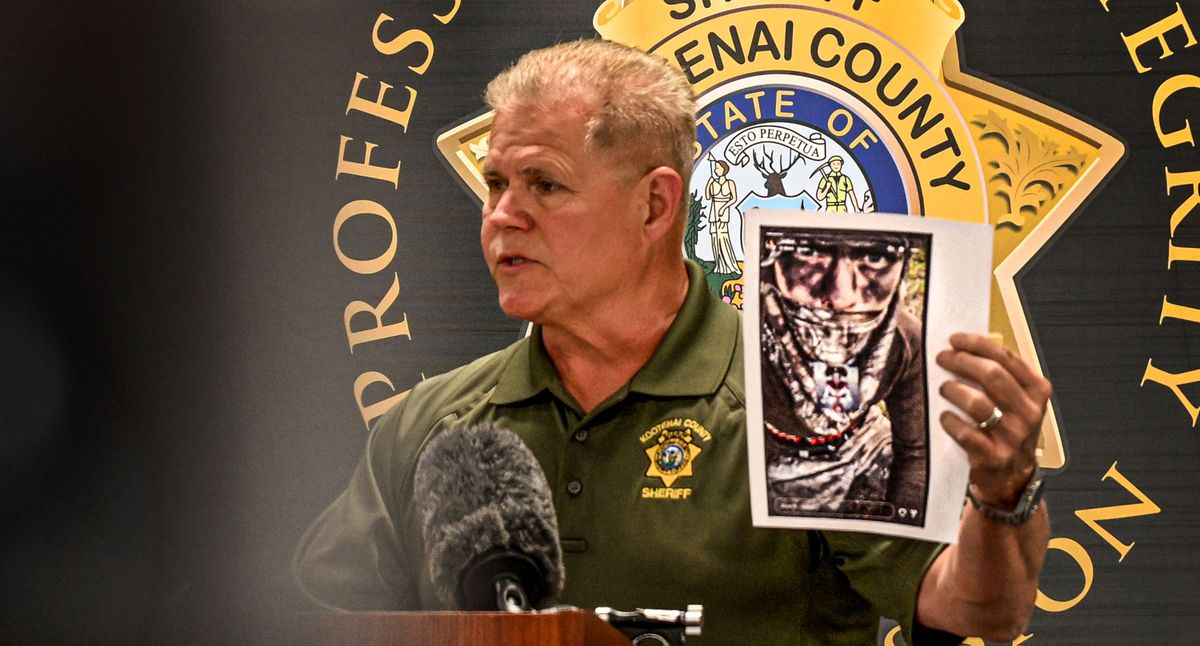 Sheriff Bob Norris holds a picture from Wess Roley’s social media page during a news conference Monday about last Sunday’s ambush and fire on Canfield Mountain in Coeur d’Alene. (Kathy Plonka/The Spokesman-Review)