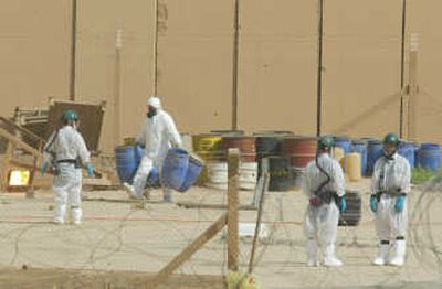 U.N. inspectors work at the nuclear facility in Tuwaitha,  south of Baghdad, in June 2003.   Associated Press
 (File Associated Press / The Spokesman-Review)