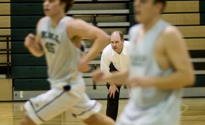 Northwest Christian coach Ray Ricks has guided the talented Crusaders to their sixth consecutive state appearance. (Colin Mulvany / The Spokesman-Review)